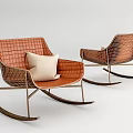 Modern Woven Orange Rocking Chair With Beige Cushion And Metal Frame Design