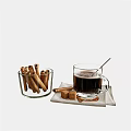 Warm Coffee Cup With Cinnamon Sticks In Glass Bowl And Sugar Cubes On Napkin