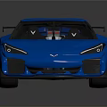 Blue Corvette Sports Car With Rear Spoiler And Black Performance Wheels