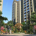 Lush Garden Landscape with High Rise Buildings Vine Covered Arches Trees Flowers and People Walking