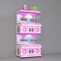 Pink Two Tiered Claw Machine With Cartoon Decoration On Top And Coin Slots