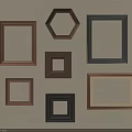 Multiple Wooden And Black Frames In Various Shapes Arranged On Beige Wall