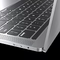Sleek MacBook Pro Laptop With Silver Body And Wave Landscape Screen Modern Design
