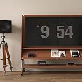 Wooden TV Stand With Large Screen Photo Frames Game Controller And Tripod Speaker