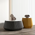 Modern Black And Yellow Coffee Tables With Textured Surfaces And Decorative Items On Wooden Floor