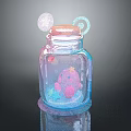 Decorative Glass Jar With Pink Lid And Colorful Elements For Home Decoration