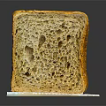 Freshly Baked Sourdough Bread Slice with Air Pockets on White Background