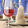 Elegant Wine Bottle And Glasses On Dining Table With Folded Napkin Silverware City Skyline