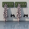 Swing Door With Green Hook Boards Hanging Plaid Coats And Game Controllers
