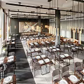 Elegant Modern Restaurant Interior With Hanging Chandeliers Large Windows Wooden Tables And Leather Chairs