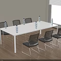 Long White Conference Table With Black Chairs And Water Bottles In Modern Office