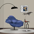 Blue Petal Shaped Leisure Chair With Curved Floor Lamp Side Table Plant And Wall Art