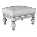 Elegant Ottoman With White Cushioned Top And Decorative Black Wooden Legs