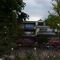 Traditional Chinese Boutique Guesthouse Surrounded by Lush Trees Pink Blossom Flowers and Garden Lights