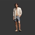Man In Light Cardigan And Shorts Standing Against Gray Background With Floor Reflection