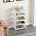 White Multi Tiered Shoe Rack with Shoes Handbag and Potted Plant on Top Shelf