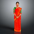 Elegant Woman Wearing Traditional Red Saree With Green Blouse And White Patterns