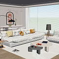 Modern Living and Dining Room with White Sofa Pillows Round Coffee Table and Dining Table