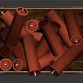 Commercial Equipment With Red Cylindrical Items Stored In Wooden Crate