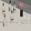 Elegant Marble Countertop With Glass Bottles Wine Glasses And Flower Vase