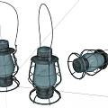 Three Vintage Kerosene Lanterns Two Standing One Lying With Metal Frames Glass Shades