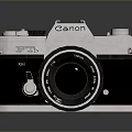 Canon Vintage Camera With Silver Black Body And Lens On Reflective Surface