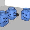 Three Transparent Square Storage Jars with Lids One with Handle and Lid Placed Aside