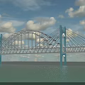 Modern Suspension Bridge With Arch Structure Blue Towers Steel Cables Over Water And Blue Sky