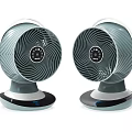 Two Modern Air Cooler Fans With Spiral Blades And Digital Control Panel