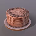 Delicious Chocolate Cake With Spiral Cream Decoration And Chopped Chocolate Sprinkles On Round Tray