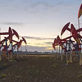 Multiple Heavy Duty Oil Pumpjack Units Arranged On Open Oilfield Site Under Beautiful Sunset Sky