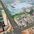 Aerial View of Modern School Campus Buildings With Green Rooftops Surrounding Roads and Sports Field