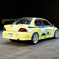 Yellow Sports Sedan With Body Decals Rear Spoiler And Sporty Exterior Design