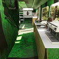 Cozy Restaurant Interior With Green Wood Grain Benches Tables And Natural Light Through Windows
