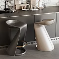 Modern Bar Counter With Black And Beige Leather Bar Stools Gold Base And Dark Countertop