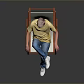 Man Sitting On Orange Folding Chair Wearing Yellow T Shirt Blue Jeans And White Shoes