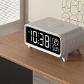 Modern Digital Alarm Clock with LED Display on Wooden Desk Showing Time and Date