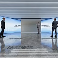 Modern Exhibition Hall With Large Screen Polished Floor Ceiling Light Strips And Visitors