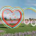 Colorful Heart Shaped Garden Ornament With Swing In Purple Flower Field Under Blue Sky