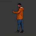 Man in Orange Jacket With Bandana Holding Phone Against Gray Background