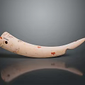 Ivory Colored Horn Shaped Household Item With Red And Black Decorative Patterns