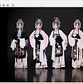 Women In Traditional Chinese Opera Costumes With Elaborate Embroidery And Ornate Headdresses Against Black Background