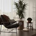 Black Leather Leisure Chair With Brown Blanket Metal Frame And Mountain View Through Window