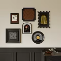 Diverse Abstract Paintings on Wall with Various Black Frames and Unique Shapes 3d model