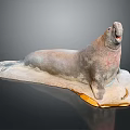Realistic Seal Sculpture In Lying Pose With Rocky Base And Open Mouth