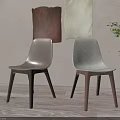 Minimalist Dining Chairs With Light Seats Dark Light Wooden Legs And Green Plant Background