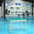 Industrial Equipment Workbench With Green Top And Lamp In Modern Factory Workshop
