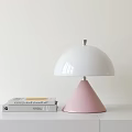 Modern Table Lamp With White Dome Lampshade And Pink Cone Base By Stacked Books
