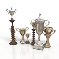 Various Trophy Collection Display With Silver And Gold Metal Designs And Spiral Wooden Bases