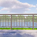 Modern Metal Railing Along Waterfront Road With Green Trees And Clear Sky